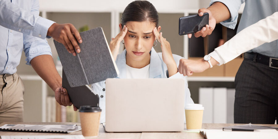 Stress, anxiety and multitasking business woman with headache from workload and laptop deadline in office. Burnout, frustration and overwhelmed lady exhausted, procrastination in toxic workplace.